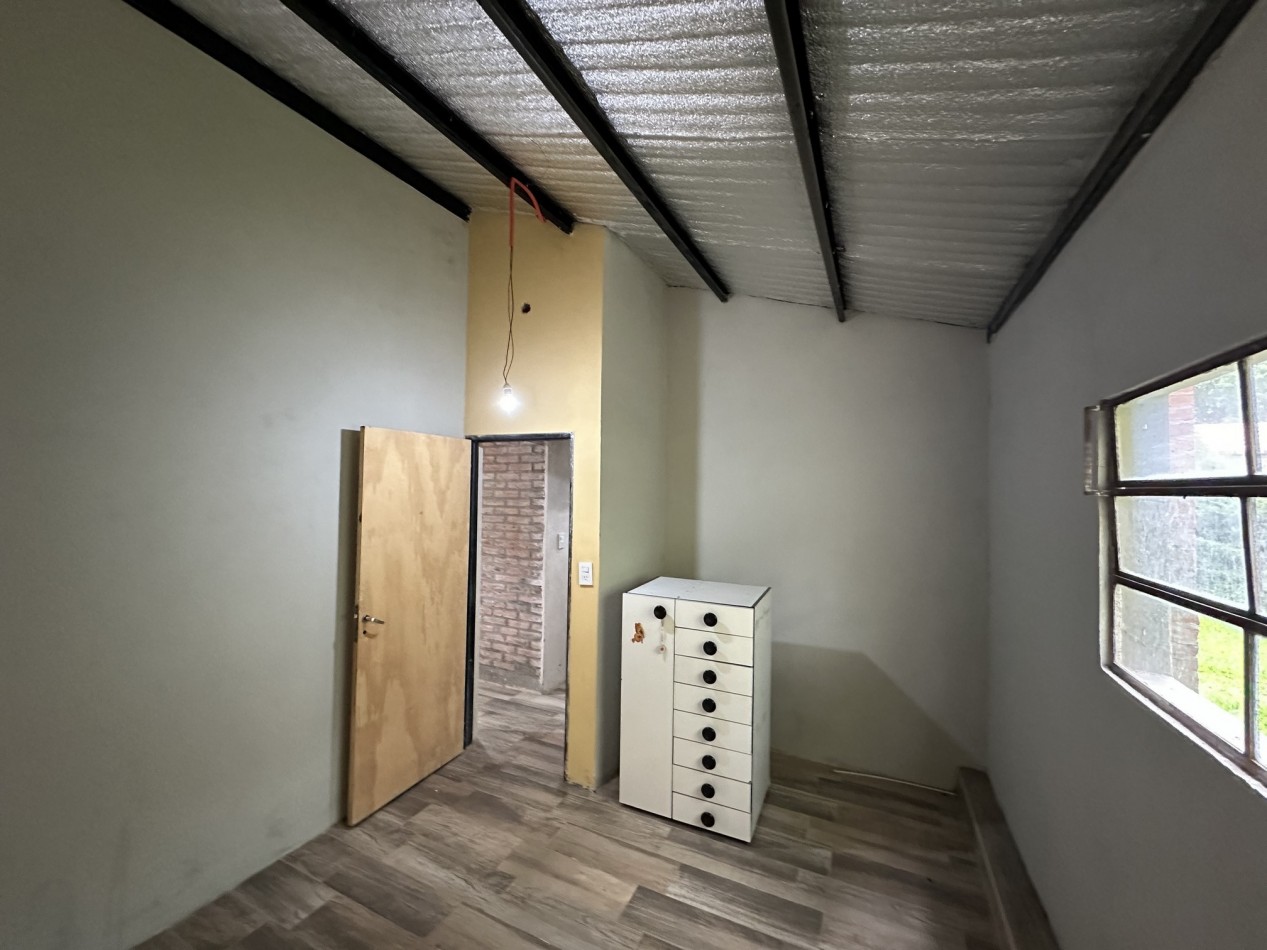 Venta Casa un dormitorio con parque forestado